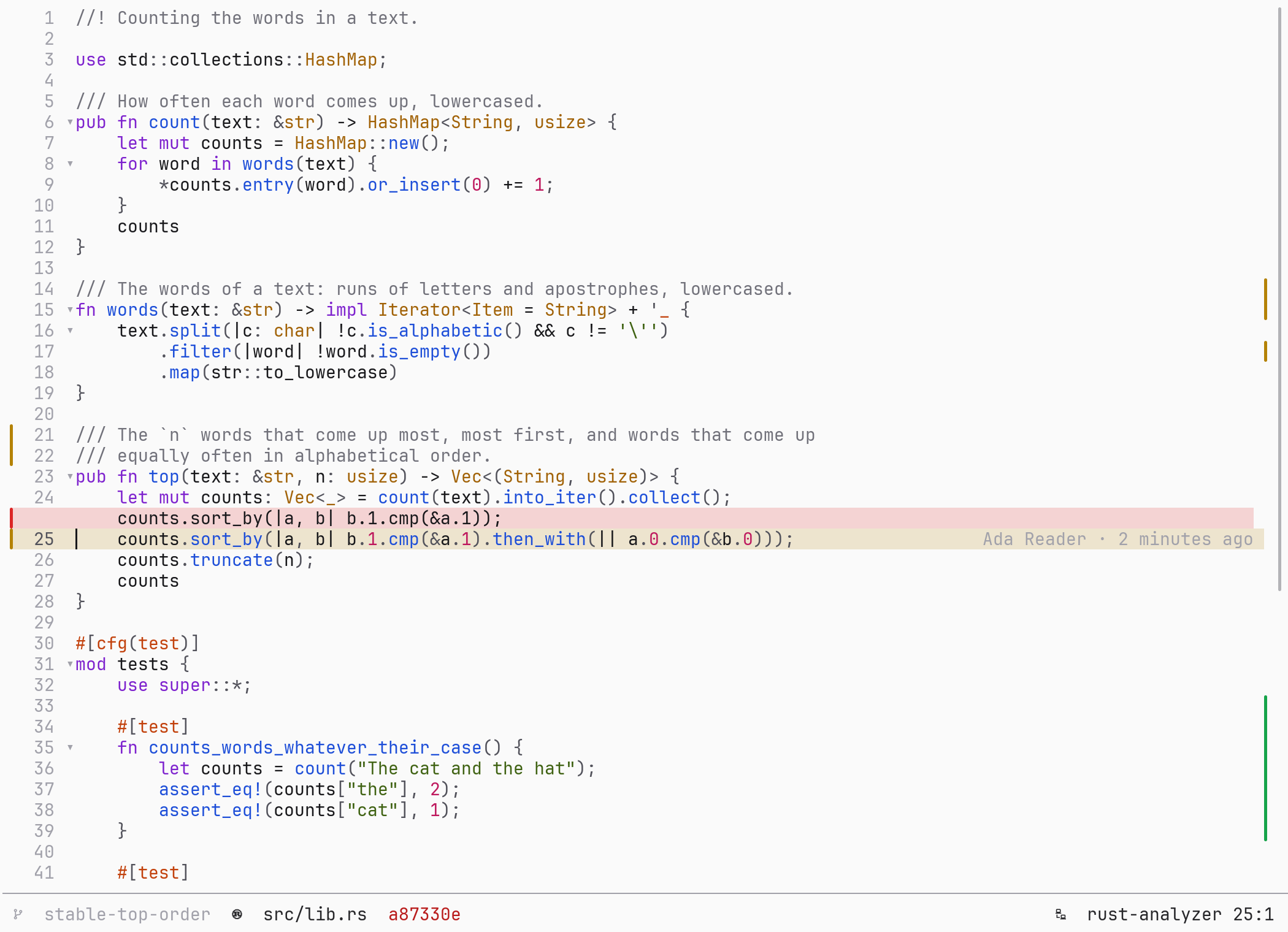 A Rust file open at a commit, with one changed line expanded in place: the old line above the new one.